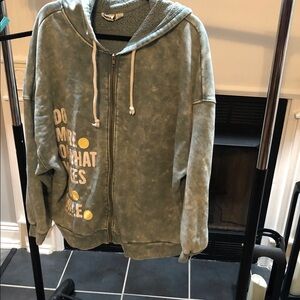 Soft Green Zip-Up Hoodie with Graphic Dots